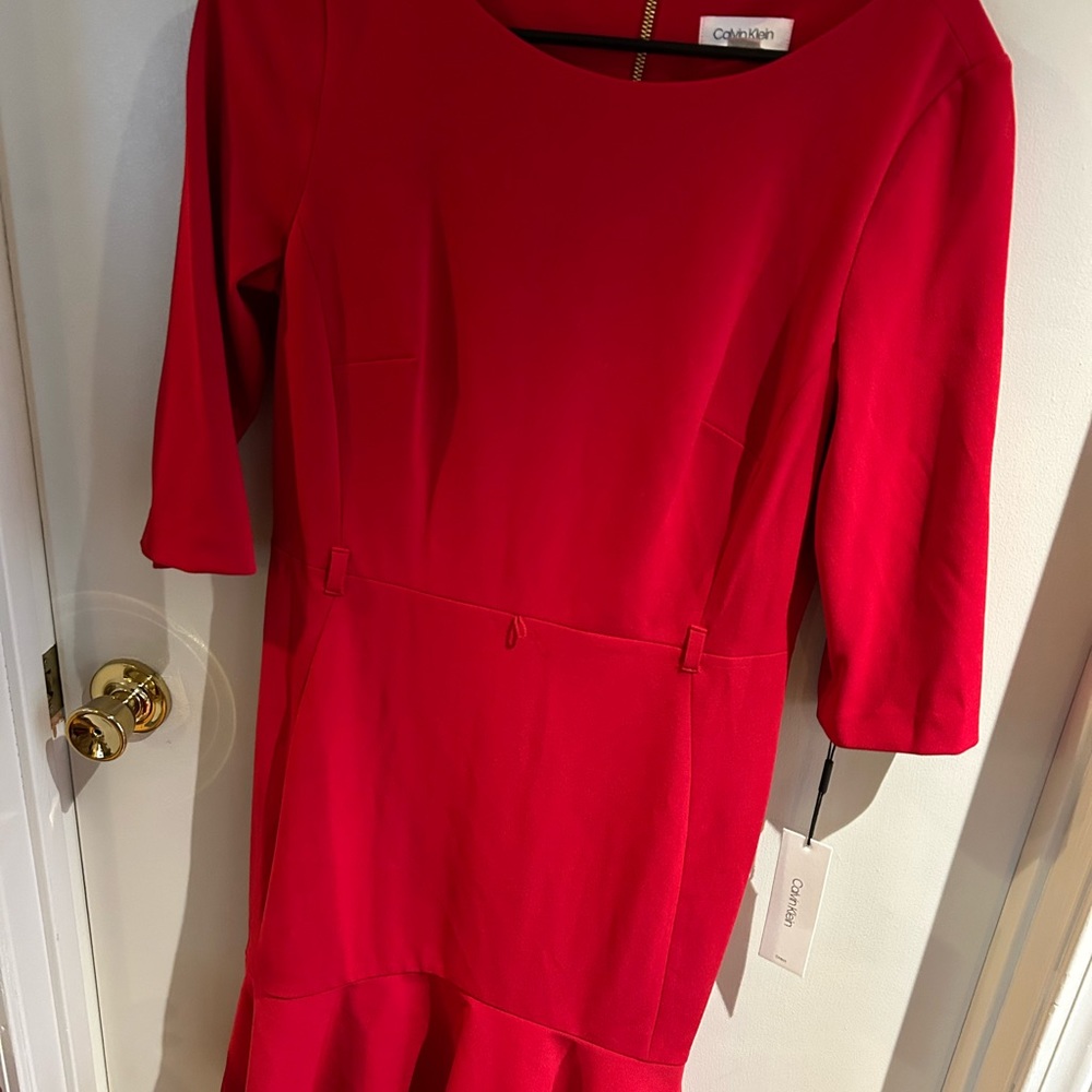 Calvin Klein red body con midi dress with bottom ruffle.